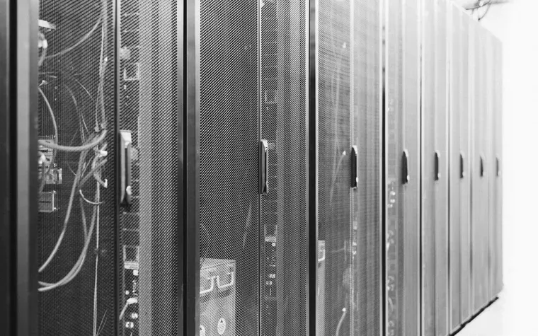 Row of server cabinets receding down a data-centre aisle