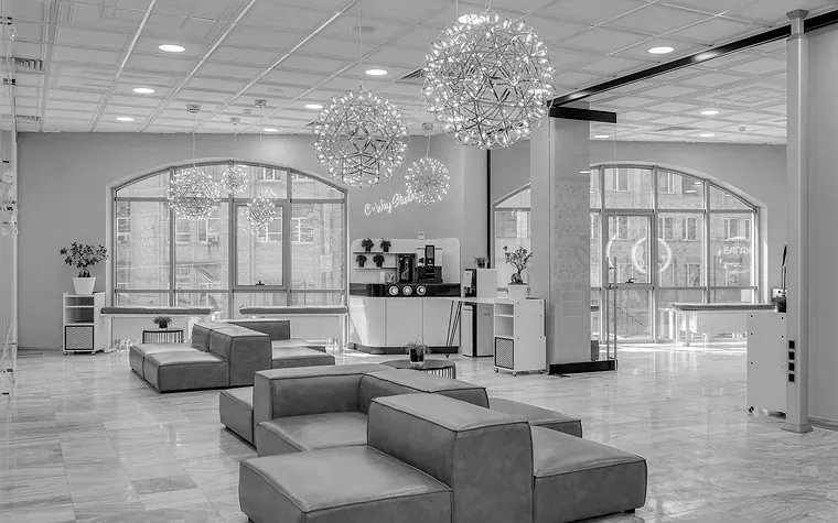 Empty office lobby with sculptural pendant lights