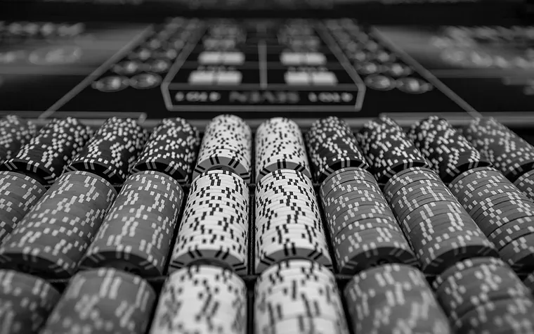 Stacks of casino chips ranked on a gaming table
