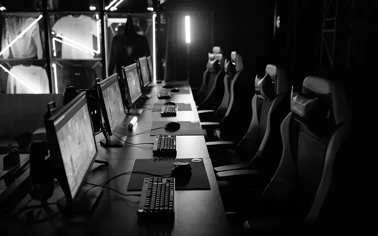 Empty gaming venue with rows of screens