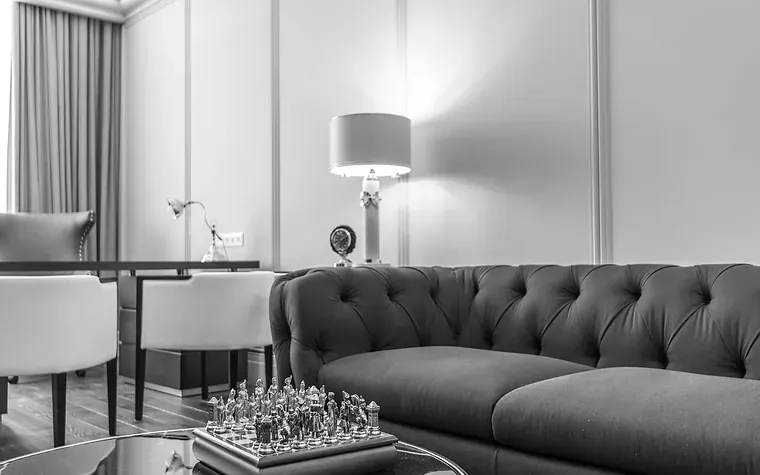 Sitting room with a chesterfield sofa and a chess set