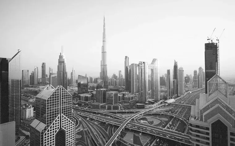 Dubai skyline at dusk above the road interchange