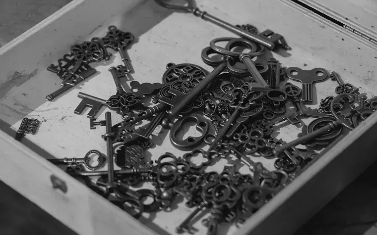 Collection of old keys in a wooden box