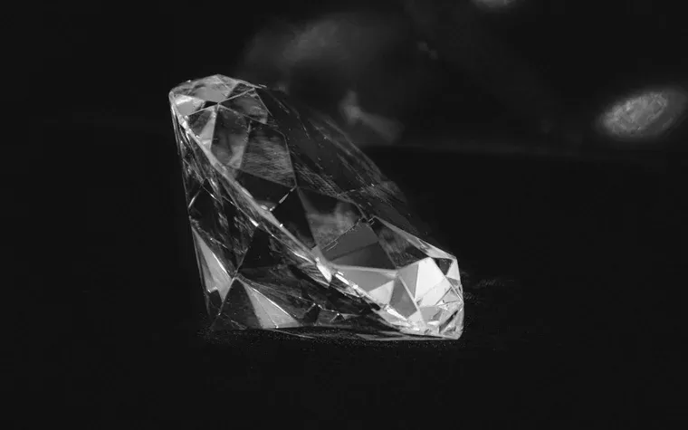 A brilliant-cut stone on a dark surface