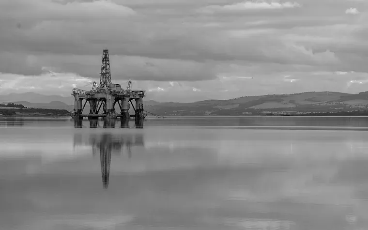 An offshore platform standing on calm water