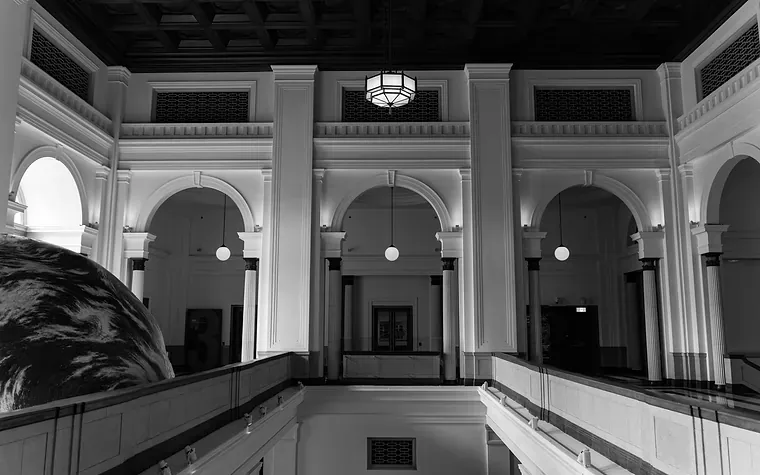 Arched banking hall with a globe on display