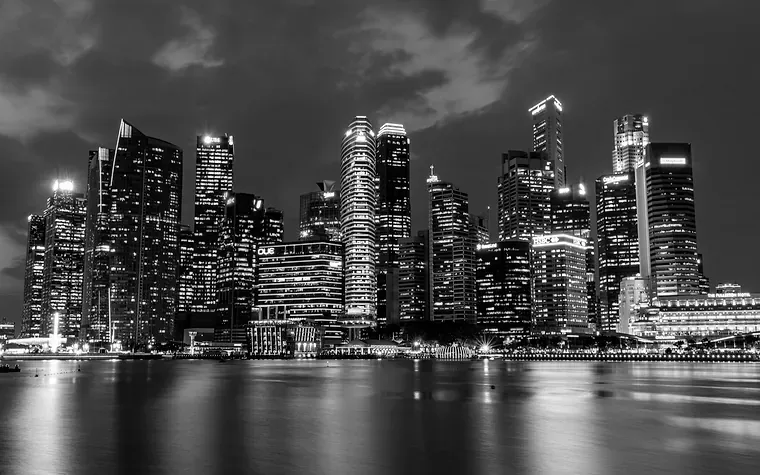 Singapore skyline at night reflected on the water