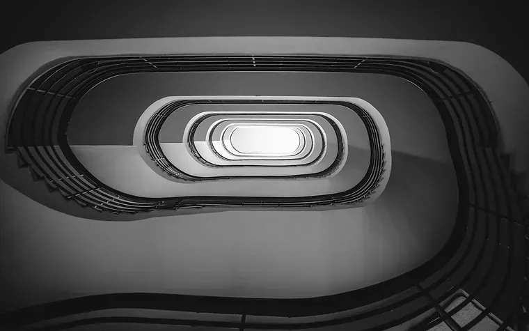 Spiral staircase seen from above, turning in on itself