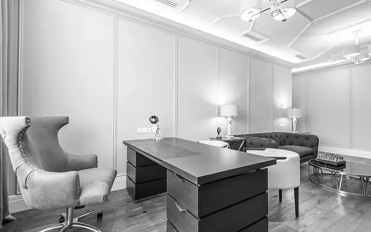 Panelled private office with a wooden desk
